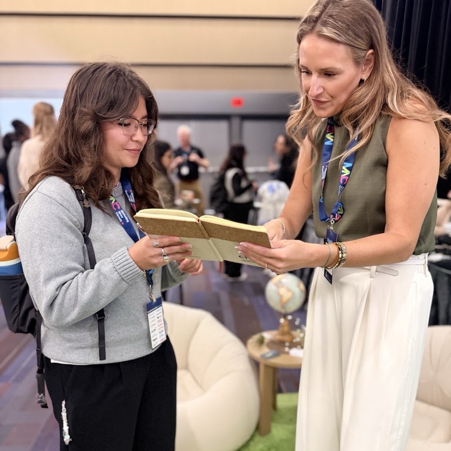 Alex working through the workbook with an attendee at Social Pacific